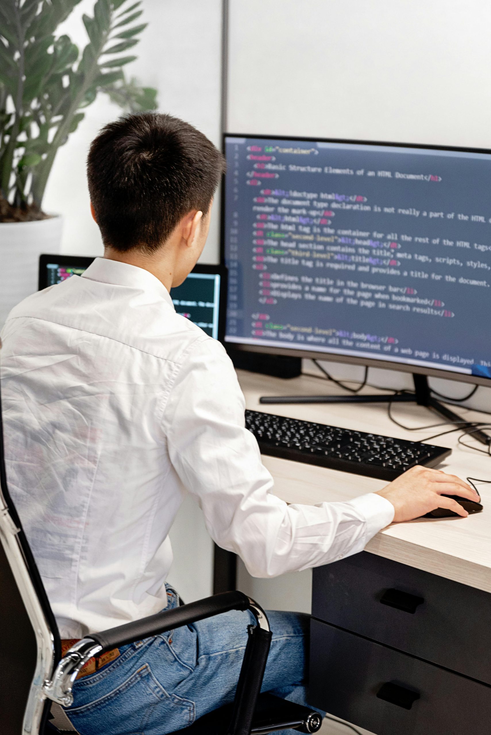 Modern web designer workspace with laptop and creative desk setup